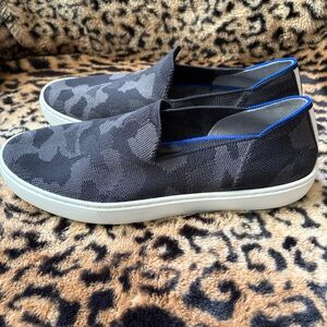 Rothy's Women's Slip-On Sneakers in Black and White with Blue Trim